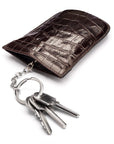 Leather key case with squeeze spring opening, brown croc, open