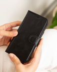 iPhone 15 case in leather with RFID, black, lifestyle view