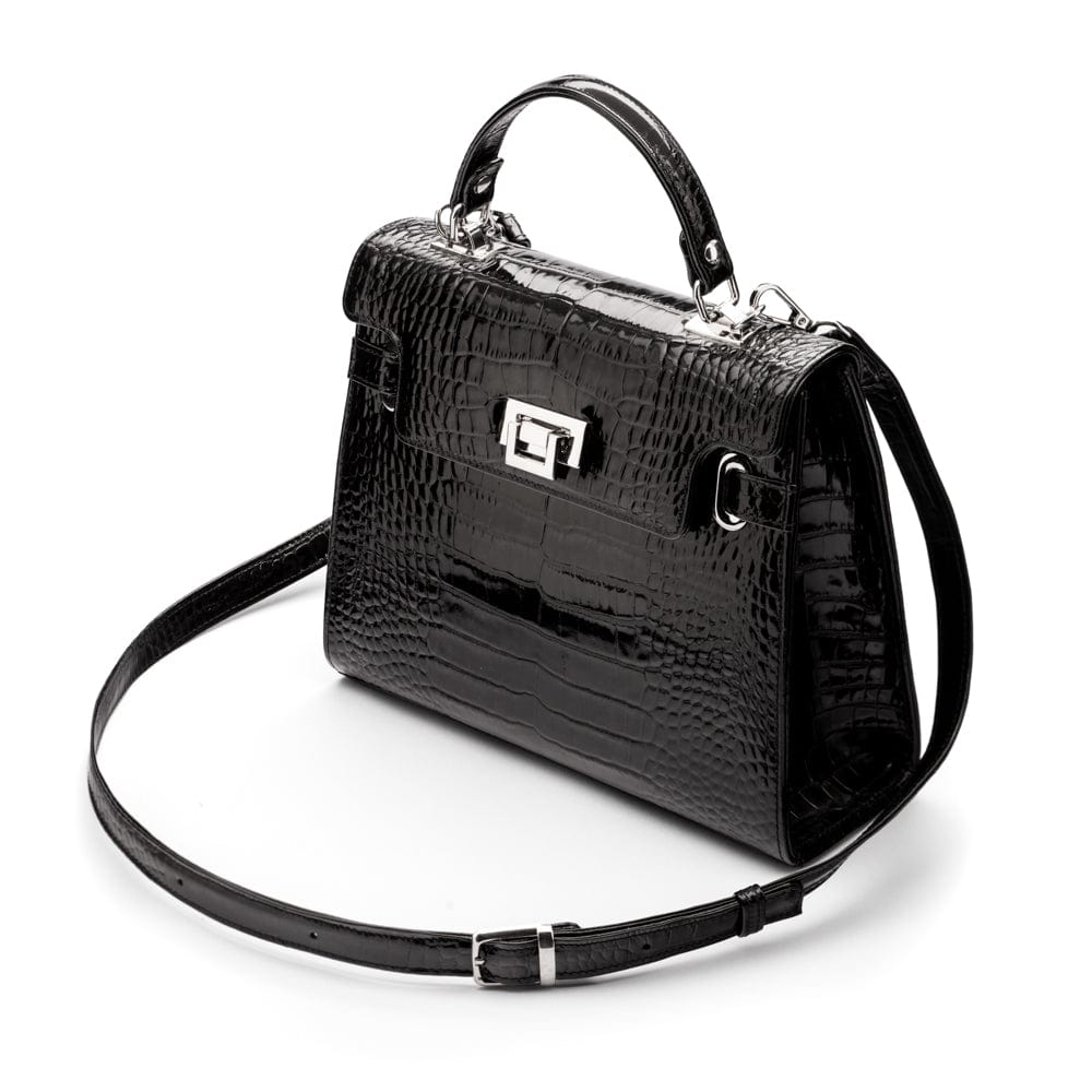 Leather Catherine top handle bag, black patent croc, side