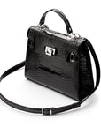 Leather Catherine top handle bag, black patent croc, side