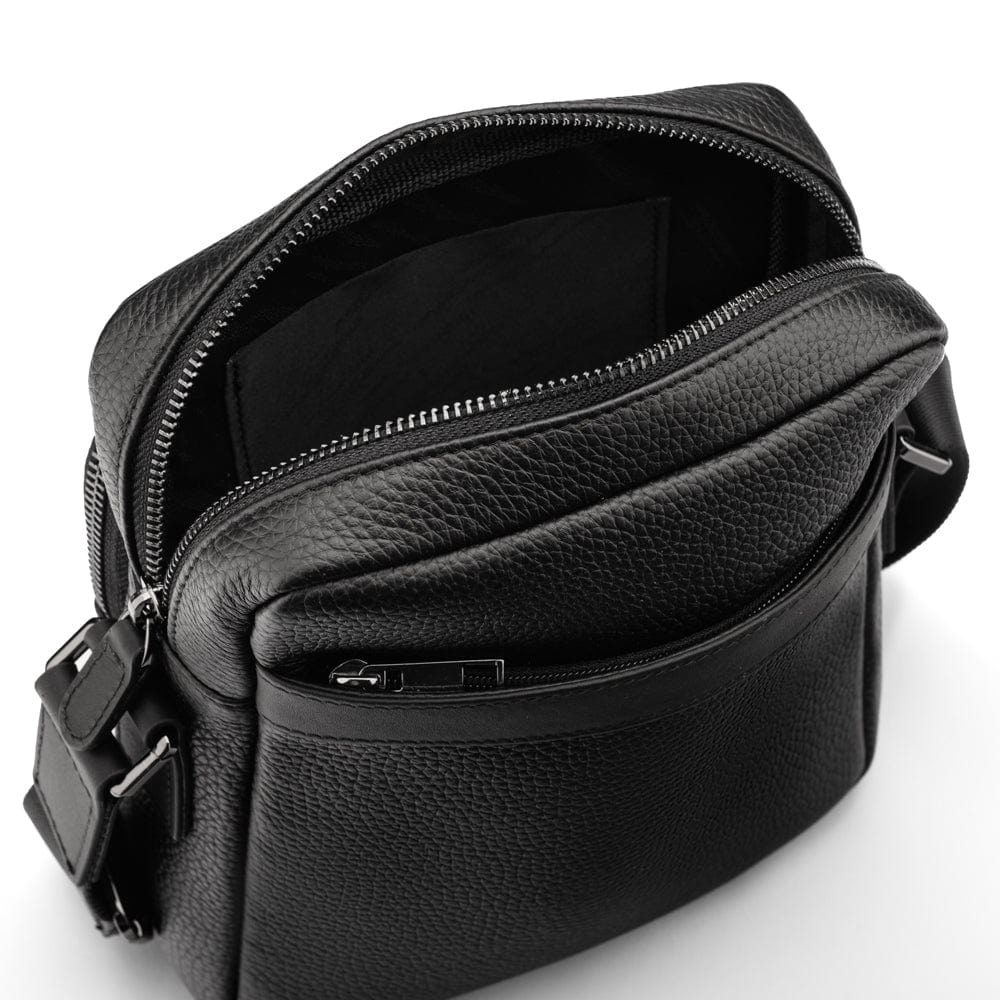 Leather messenger bag with zip, black, open from the back view