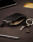 Small leather coin purse with key chain, black, lifestyle