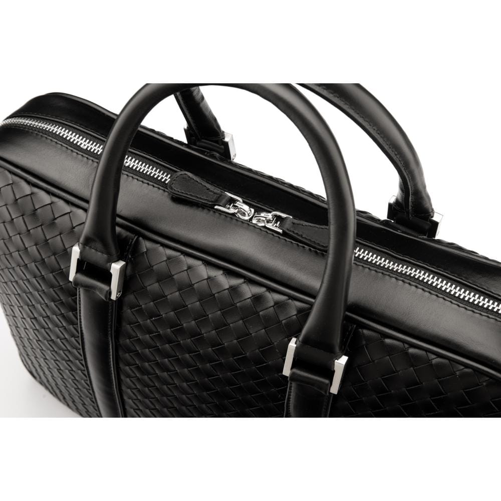 The Tressé leather laptop bag, black woven, closeup
