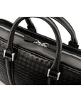 The Tressé leather laptop bag, black woven, closeup
