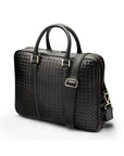 The Tressé leather laptop bag, black woven, with shoulder strap