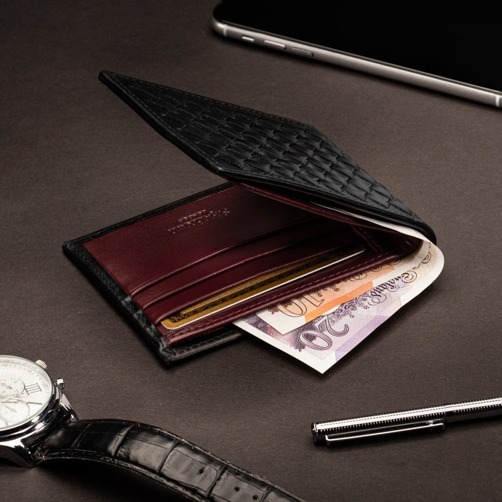 Woven leather billfold wallet with 6 credit card slots, black with burgundy, lifestyle