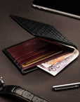 Woven leather billfold wallet with 6 credit card slots, black with burgundy, lifestyle
