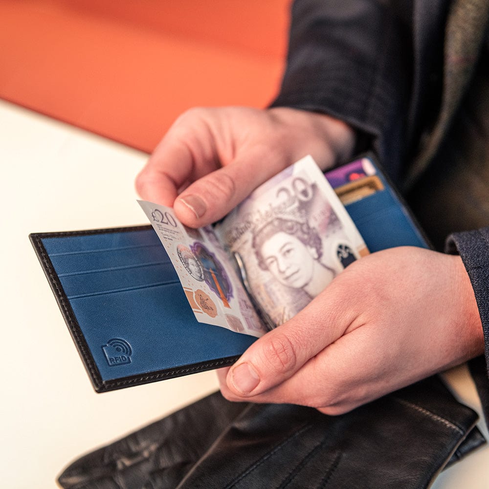 Leather money clip wallet, black with cobalt, lifestyle