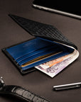 Woven leather billfold wallet with 6 credit card slots, black with cobalt, lifestyle
