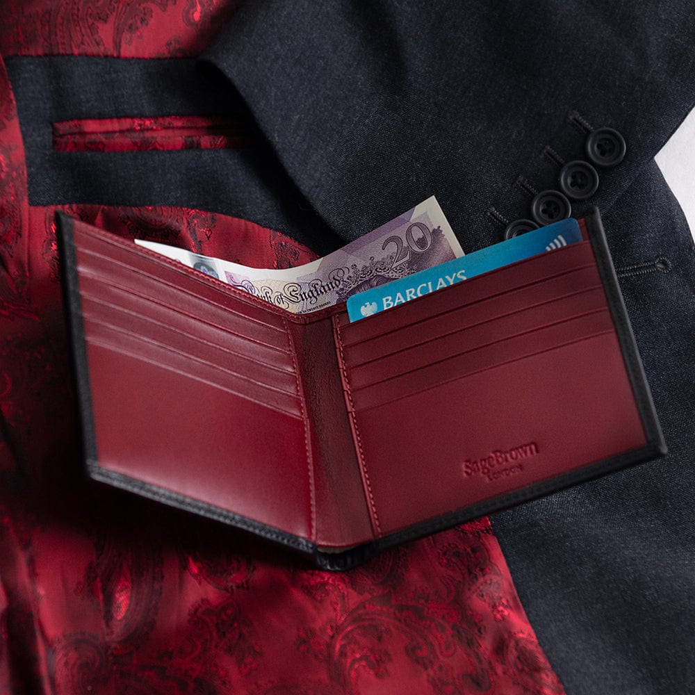 Men's leather billfold wallet, black with red, lifestyle