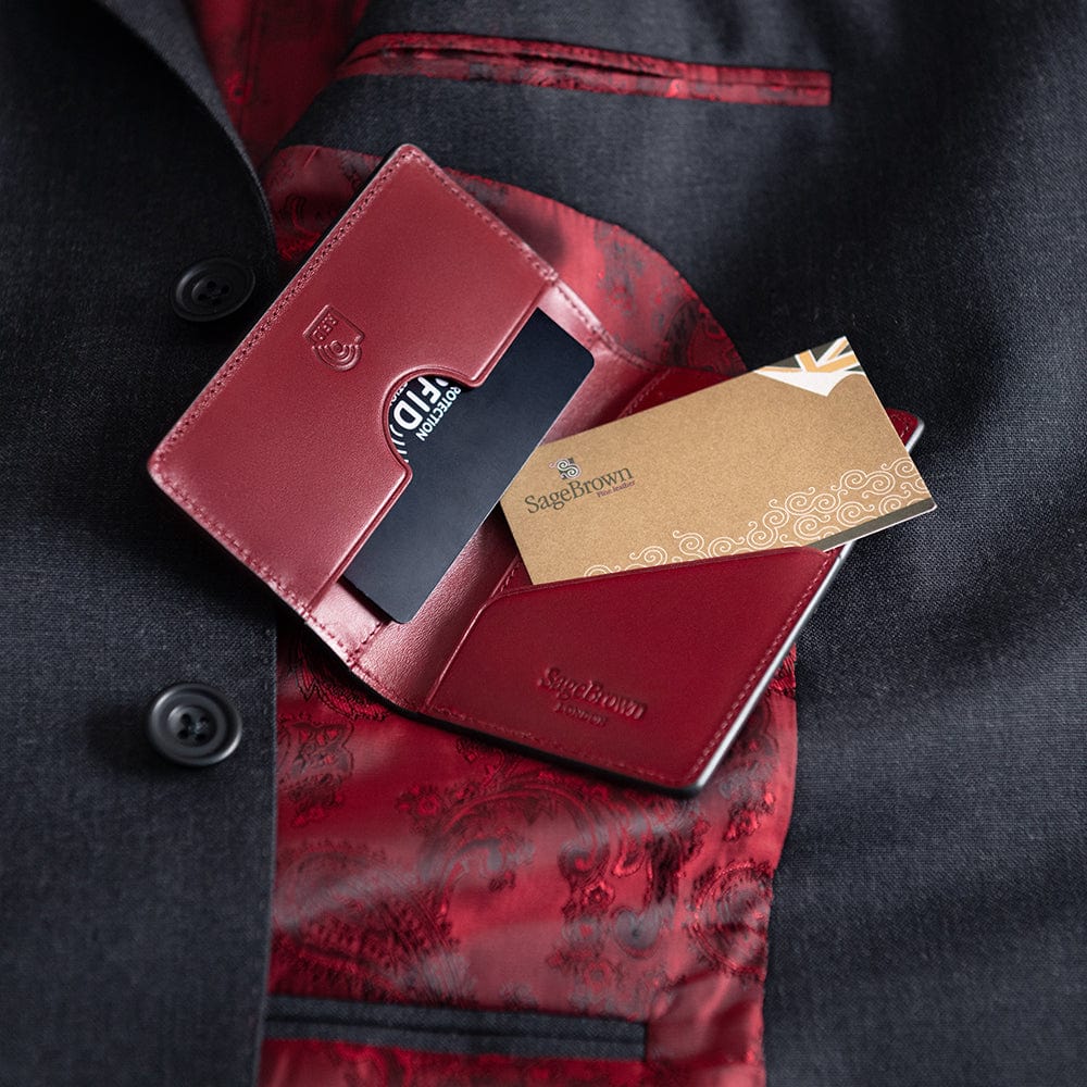 Leather card holder with RFID protection, black with red, lifestyle