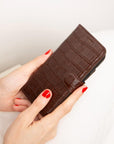 iPhone 15 case in leather with RFID, brown croc, lifestyle