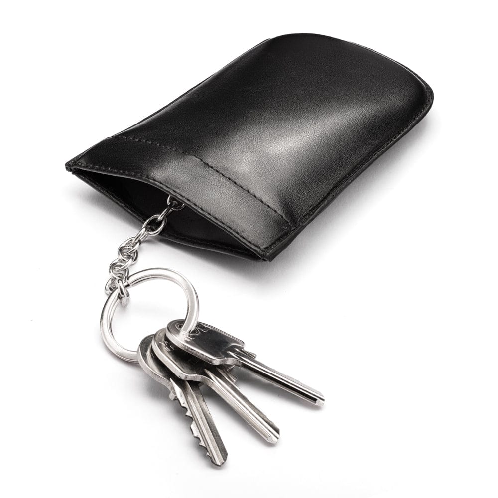 Leather key case with squeeze spring opening, black, open 