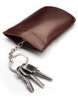 Leather key case with squeeze spring opening, brown, open