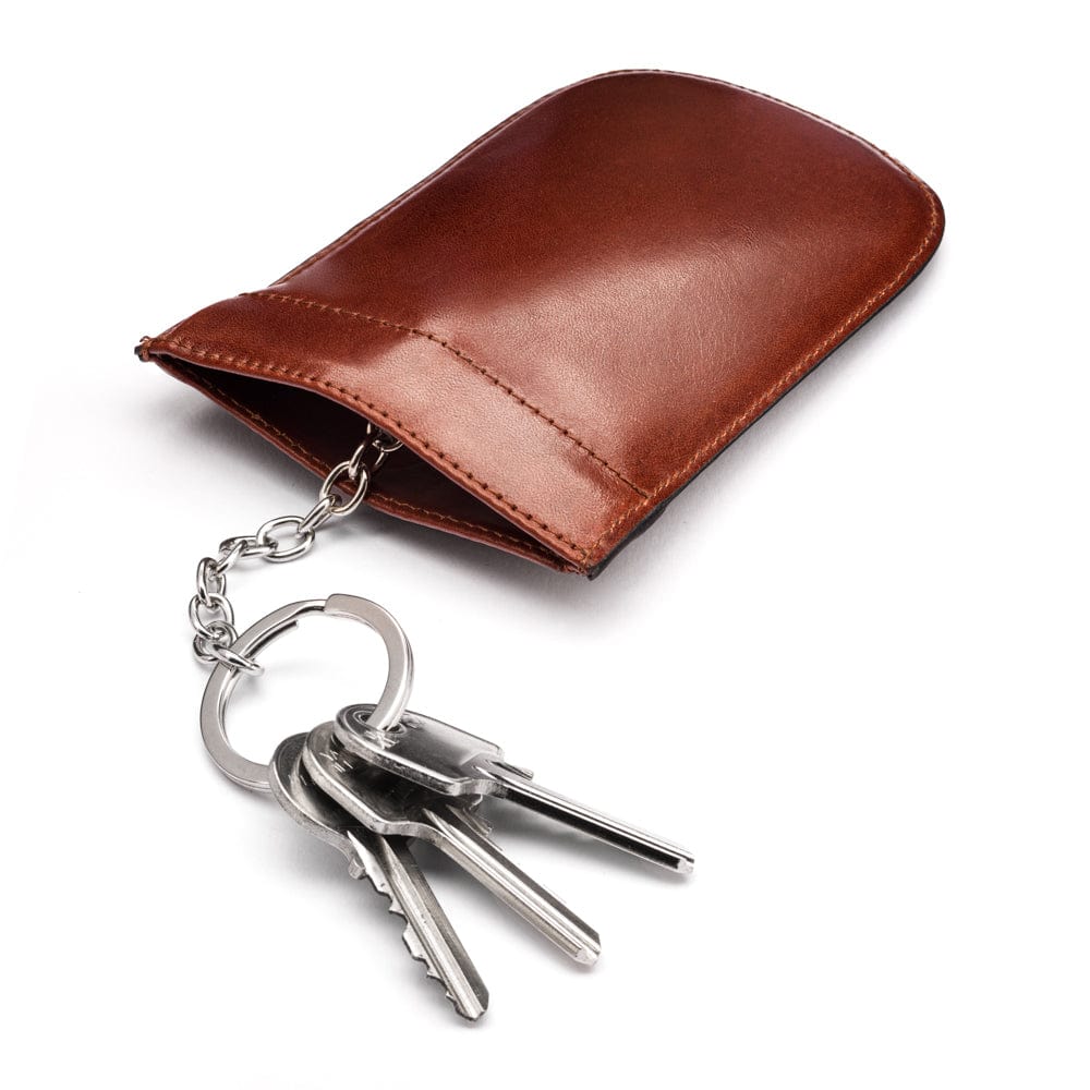 Leather key case with squeeze spring opening, dark tan, open