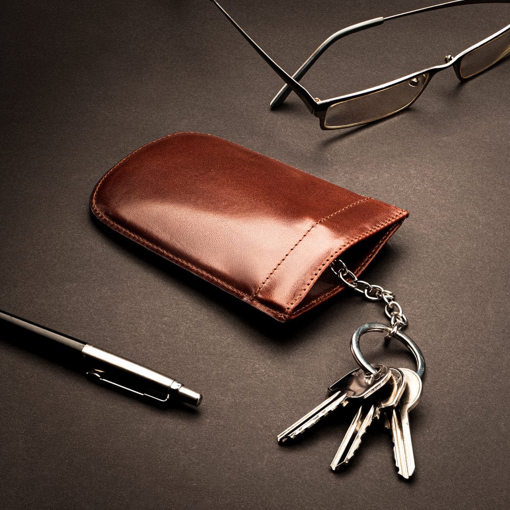 Leather key case with squeeze spring opening, dark tan, lifestyle