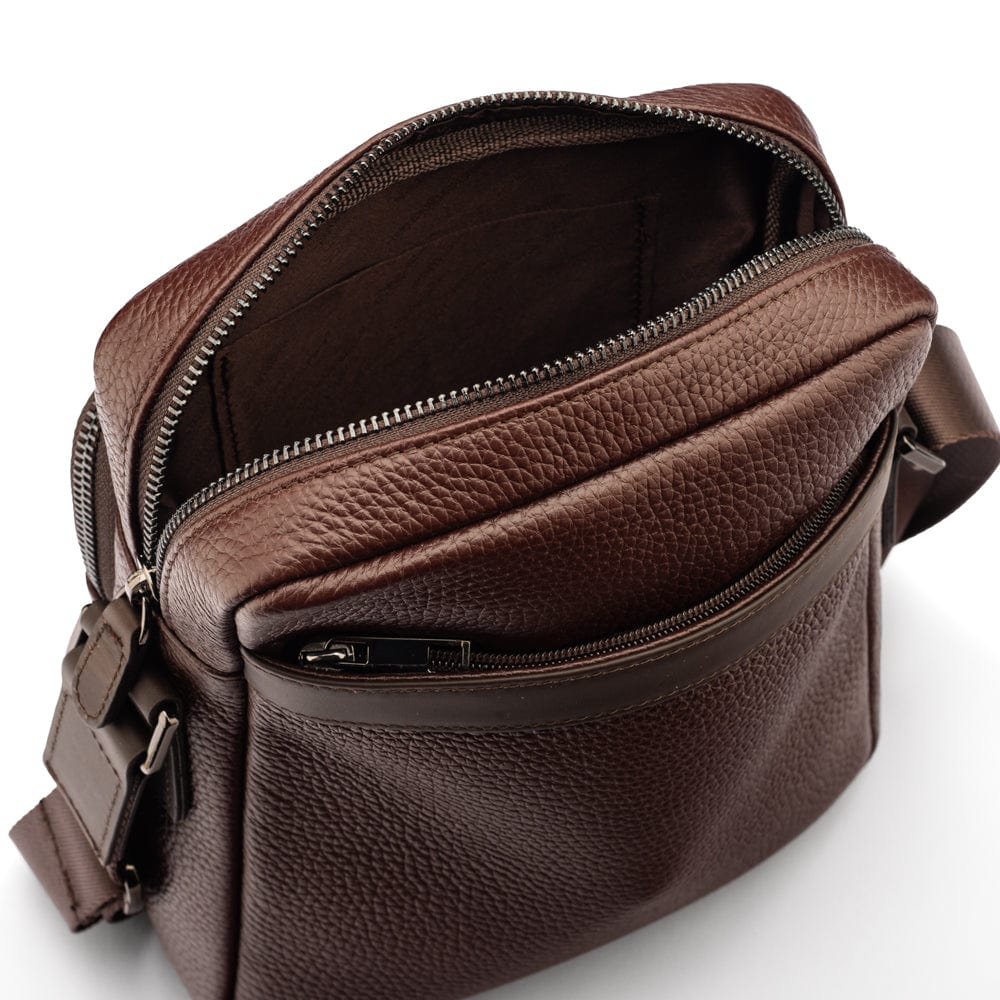 Leather messenger bag with zip, brown, open from the back view