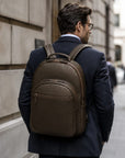 Men's leather 15" laptop backpack, brown, on a males back
