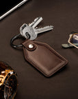 Rectangular leather key fob, brown, lifestyle