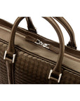 The Tressé leather laptop bag, brown woven, closeup