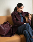 Woven leather slouchy bag, burgundy, lifestyle