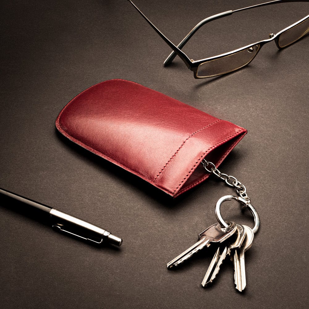 Leather key case with squeeze spring opening, burgundy, lifestyle