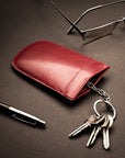 Leather key case with squeeze spring opening, burgundy, lifestyle