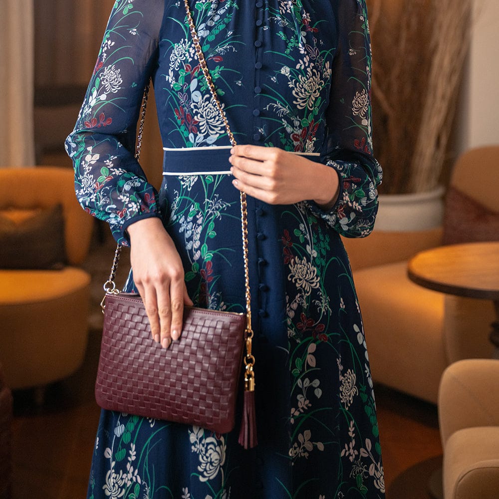 Leather woven cross body bag, burgundy, lifestyle view