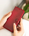 iPhone 15 Pro case in leather with RFID, burnished red, lifestyle