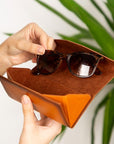 Triangular leather glasses case, burnished tan, lifestyle view