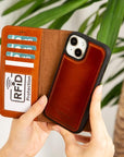 iPhone 15 case in leather with RFID - burnished tan, lifestyle