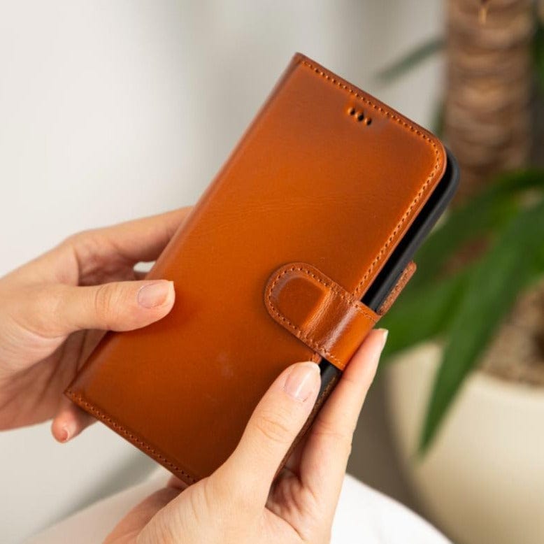 iPhone 15 case in leather with RFID - burnished tan, lifestyle