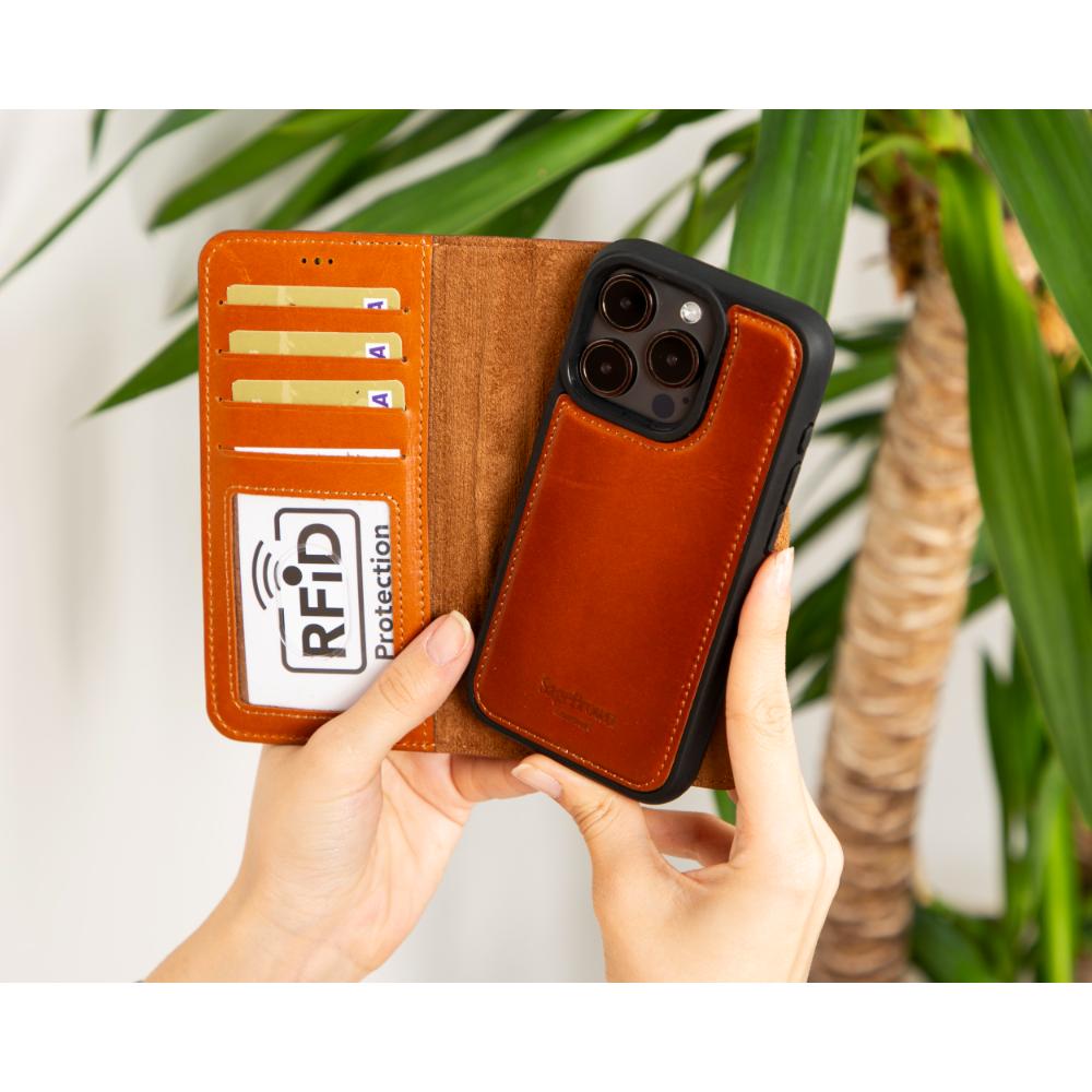 iPhone 15 Pro case in leather with RFID, burnished tan, lifestyle