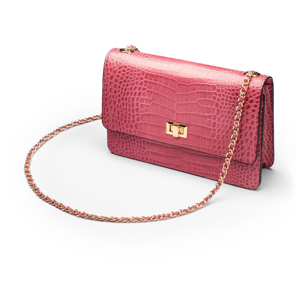 Leather chain bag, cerise pink croc, side view