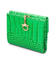 Leather purse with equestrain clasp, emerald croc, front