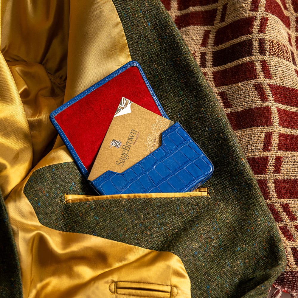 Leather business card holder with magnetic closure, blue croc, lifestyle