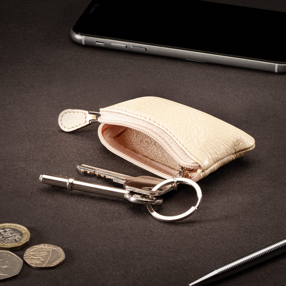 Miniature leather coin purse with key chain, cream, lifestyle