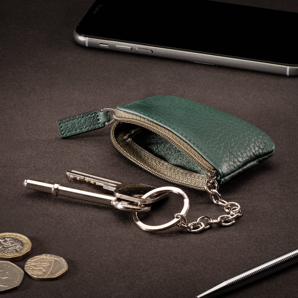 Miniature leather coin purse with key chain, dark green, lifestyle