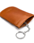 Leather key case with squeeze spring opening, havana tan, back