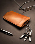 Leather key case with squeeze spring opening, havana tan, lifestyle