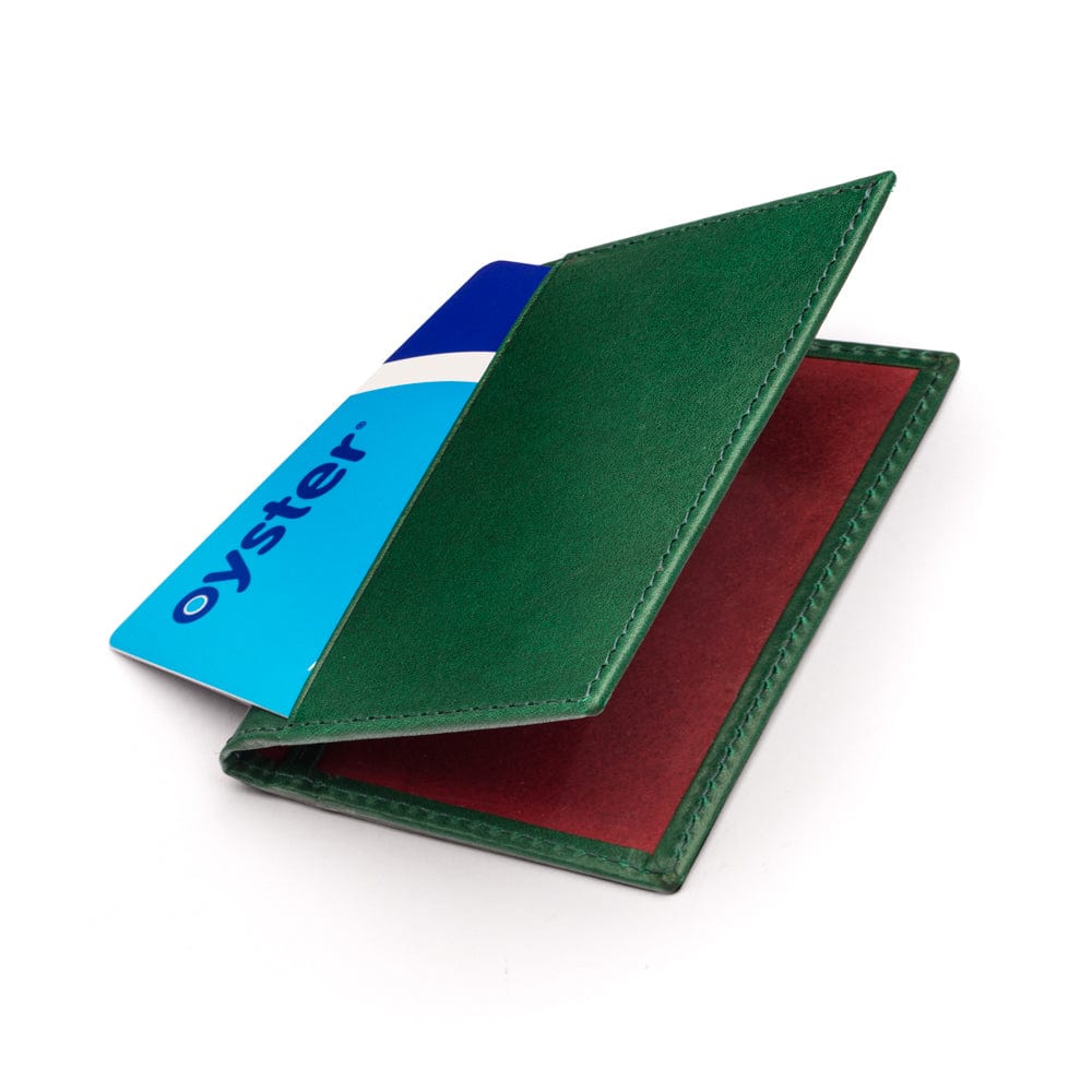 Leather travel card wallet, emerald green with red, front
