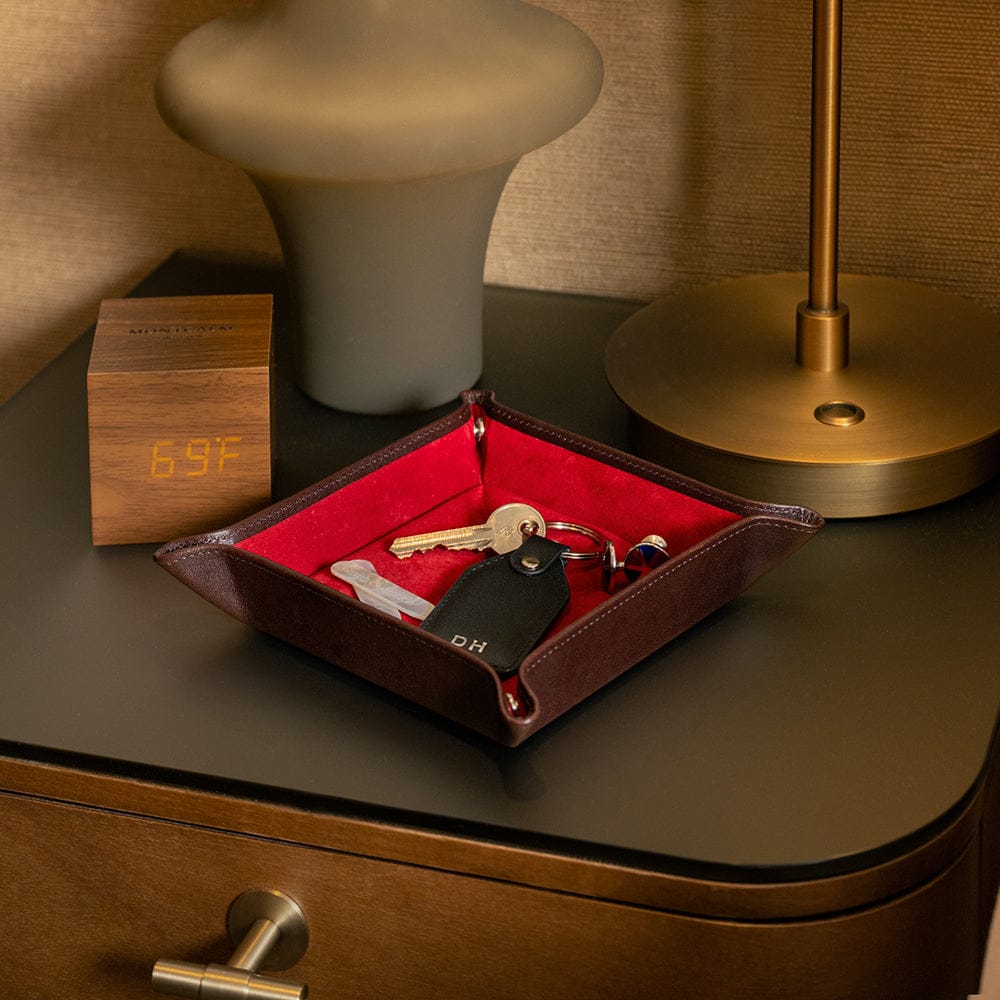 Leather valet tray, dark tan with red, lifestyle