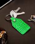 Rectangular leather key fob, emerald croc, lifestyle