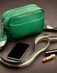 Leather cross body camera bag, emerald green, lifestyle