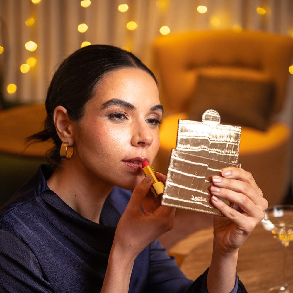 Compact leather mirror, gold croc, lifestyle