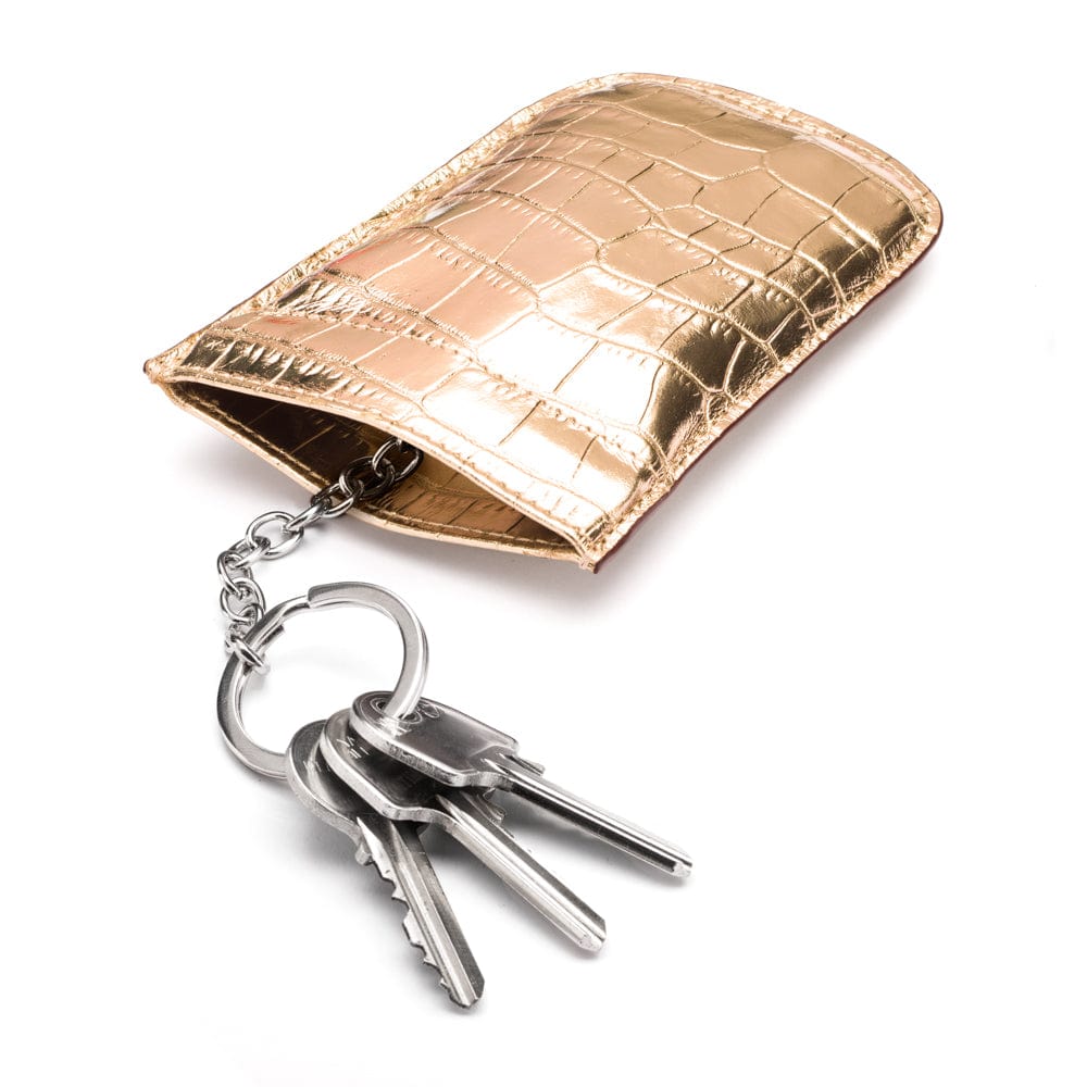 Leather key case with squeeze spring opening, gold croc, open