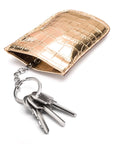 Leather key case with squeeze spring opening, gold croc, open