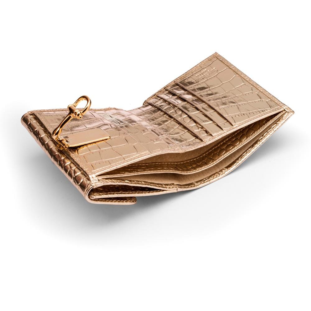 Leather purse with equestrain clasp, gold croc, inside