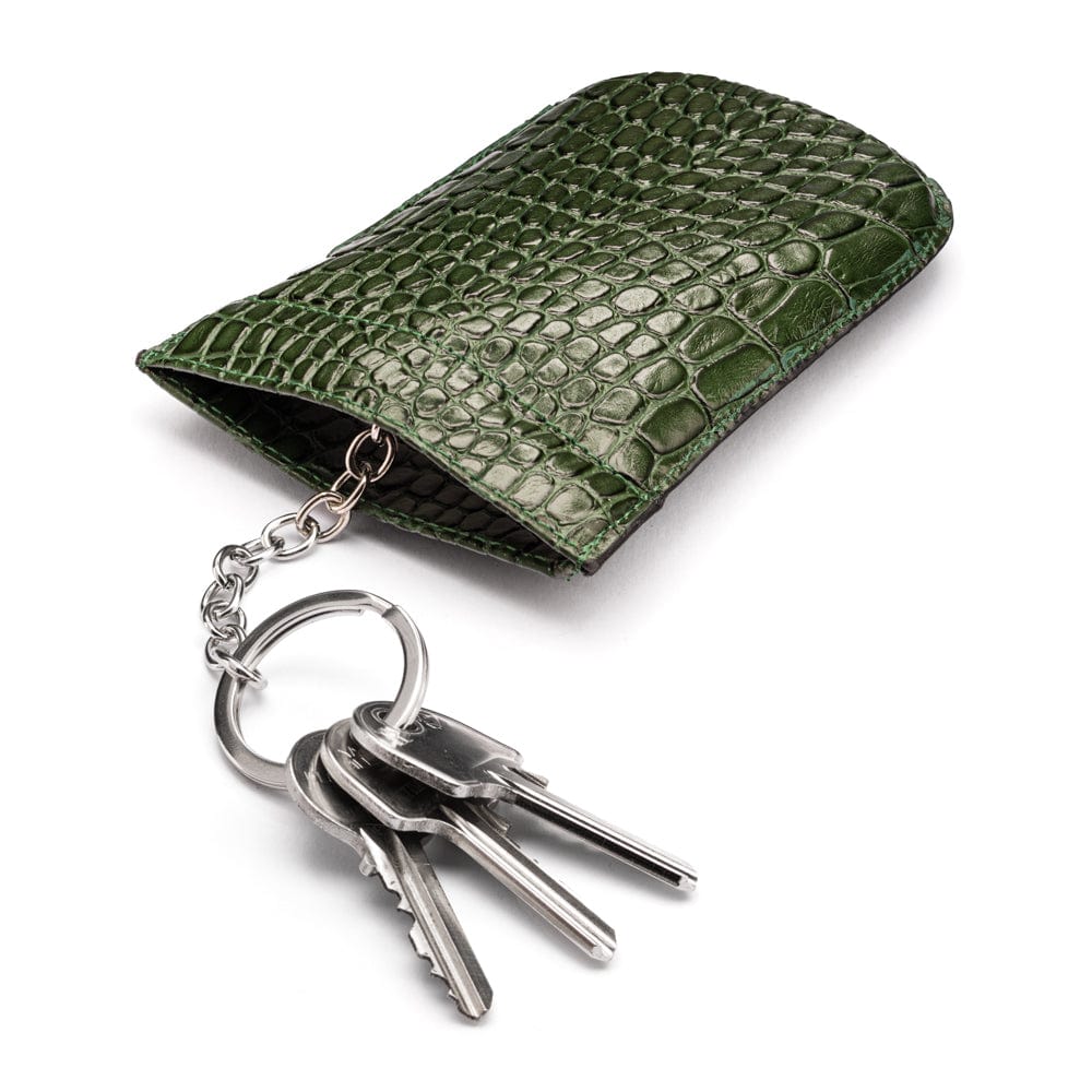 Leather key case with squeeze spring opening, green croc, open