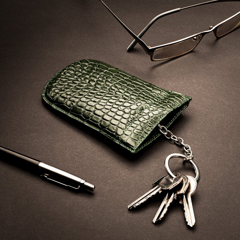 Leather key case with squeeze spring opening, green croc, lifestyle